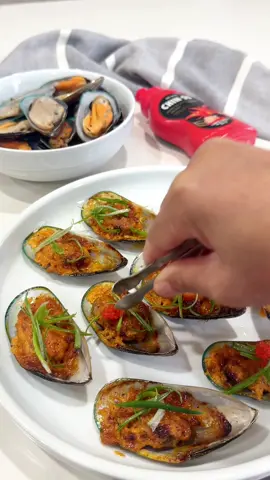 Dynamite Mussels leveled up with Chin-Su “Truffle Hot Sauce?” SAY LESS… Now let’s mix it up and make a game changing spicy mayo sauce by adding Chin-Su’s Truffle Hot Sauce to the mix!  == Recipe & Instructions Step 1: Prep (10) New Zealand Mussels  - Throughly rinse and clean the mussels  - Set aside to dry  - Once dry, set onto baking sheet  Step 2: Spicy Mayo Sauce  Blend & incorporate the following into a bowl:  - 2 tbs of mayonnaise - 1 tsp of granulated garlic powder - 1 tsp of onion powder - Dash of paprika  - Dash of Johnny’s seasoning salt  - Dash of crushed black pepper  - 2 tsp of Chin-Su Truffle Hot Sauce - Set aside  Step 3: Prepare & Air Fry  - Apply a generous amount of spicy mayo sauce onto each mussel  - Set into the air fryer at 400 degrees for 8 mins  *Every air fryer projects heat and cook time differently. Make sure to closely monitor the cook time*  Top with scallions, tobiko and ENJOY 🤤   Snag a bottle or (2) of the Truffle Hot Sauce via Amazon, SO DANG GOOOOD: https://a.co/d/iouurx9 #AD #sponsored #chinsu #chinsupartner #Recipe #hotsauce #truffle #trufflehotsauce #recipedeveloper #contentcreator #foodblogger #mussels #seattlefoodie #seafood #seafoodlover #appetizers #recipeideas #homemade #mukbang #cooking @_chinsuhotsauce_ 