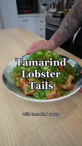 Vietnamese style Fried Lobster Tail w/ Tamarind Sauce  #nextonthemenu #onthehouse  Serves 4  Ingredients:  5 lobster tails (cut into bite sized pieces) 2 tablespoons butter  3 garlic cloves (minced)  1 jalapeño  1 Fresno chili  1 bunch scallion  Corn starch as needed  White pepper  Kosher salt to taste  White pepper to taste  Oil for frying as needed  [sauce] 6oz chicken stock  4oz tamarind concentrate (Sun Lee brand) 1 teaspoon chicken bouillon powder  1 tablespoon fish sauce  2 tablespoons palm sugar (red boat)  1 tablespoon oyster sauce  1 tablespoon shrimp paste (with soy bean oil) 1 teaspoon black pepper  2 teaspoons corn starch  [garnish] Scallion curls  Cilantro  Serrano chili  Directions: 1. Fill a heavy bottom pot with 2 inches of oil and heat it up 350 degrees Fahrenheit.  2. Prep your lobster and cut into bite size pieces. Be sure to rinse under running water to remove the shards of shells and make sure your lobster is dry after.  3. Next combine the ingredients for your sauce, mix until the palm sugar is dissolved, and set aside  4. Coat your lobster with corn starch, and fry at 350 degrees Fahrenheit for 3 minutes  5. Once they’re done transfer to a sheet tray lined with paper towel and season with kosher salt and white pepper.  6. To make the sauce Melt 2 tablespoons of butter in a large skillet then add your minced garlic and fry on medium low heat 7. Once the garlic is fragrant add your peppers, scallion bulbs and sauté until softened  8. After that mix the sauce base, add  it to your pan  9. Once the sauce is at a simmer add your lobster and stir to combine  10. Taste and adjust the seasoning if necessary  11. finish with more green scallions. Plate up and garnish with scallion curls, cilantro, and Serrano chili  #seafoodlover #seafood #lobster #vietnamese #Vietnameserecipe #stirfry 