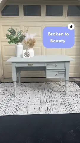 Talk about a transformation, from $0 to $250 just like that 😮‍💨😍  I found this free desk on facebook marketplace, when I picked it up it seemed great and still had the original base attached. After getting it home, I realized the base was barely holding on by a thread and snapped into peices when I set it down in my garage 🥲 Plan B kicked in and I picked up some new legs from lowes which worked perfectly and fit the original hardware plates. I did some patch work with bondo and set down a nice primer base. I then added some accents on the door with molding I found at home depot! Now this is the first time using the spray @behr primer and paint in flat and I can say it is my new FAVORITE. Super budget friendly and goes on like butter, im obsessed. This is the color Lunar Grey, so gorgeous 😍 I listed it back up for sale on Facebook for $250 after putting about $50 in materials back into it, let me know your thoughts, how do you feel about the color & design 🤔🫶🏻 • • • • • • • #furnitureflip #furnituremakeover #paintedfurniture #upcycledfurniture #furniture #furniturerestoration #upcycle #furnitureartist #homedecor #furnituredesign #DIY #refinishedfurniture #vintagefurniture #vintage #chalkpaint #interiordesign #chalkpaintedfurniture #beforeandafter #furniturepainter #refurbishedfurniture #handpaintedfurniture #upcycled #upcycling #fusionmineralpaint #diyhomedecor #handpainted #paintedfurniturelove #furnitureflipper #restoredfurniture #furniturepainting