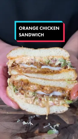 Orange Chicken Sandwich 🍊 I’ve posted the ingredients on my IG.  🥪 My digital cookbook, ‘Between The Bread’ is now available. Grab your copy today via the link in my bio & enjoy my top gourmet sandwich recipes.  #orangechickensandwich #sandwich #sandwiches #cookingforthebro #foodcreator #brothers #chickensandwich #sandwichtok #sandwichtiktok #recipesoftiktok 