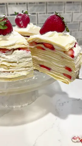 I am completely OBSESSED with “Strawberries & Cream Mille Crepe Cake.” Layer by layer of fluff, bounce, & a decadently whipped frosting that will have you crawling back for MORE! To get this wonderful & super convenient crepe maker, visit Amazon: https://a.co/d/28bUunY OR visit the link in my bio.    Recipe & Instructions: 1. PREP CREPES - Combine 1.5 cups of AP flour & 1 tsp of salt - Create a reservoir in the center of the bowl & add (4) eggs  - Gradually beat in 1.5 cups of milk  - Set aside & let it rest for a minimum of 30mins * Optional to repeat this step for more layers*  2. PREP WHIPPED CREAM  - To a mixer add (3) cups of heavy whipping cream  - 2 tsp of vanilla extract  - Mix at level 4 and gradually increase up to level 6 until light & fluffy  - Set in fridge until we’re ready to frost  3. PREP STRAWBERRIES  - Rinse, pat dry and cut (7) strawberries in equal parts & into halves  - Reserve (5) whole strawberries  - Set aside  4. CREPES - Set @cucina.pro  Electric Crepe Maker to level 3  - Glide a light spread of butter  - Add 1/3 cup of crepe mix to the maker  - In a circular motion, spread the crepe across the maker  - Cook for 30-45 seconds, flip & cook for an additional 30 seconds  - Set aside & continue to prepare the rest of the mixture  - Once completed, stack the crepes and cut the crepes with a cake ring cutter  5. FROSTING - Spread whipped cream to each crepe layer by layer  - Add strawberries to any layer as preferred  - Frost the sides of the cake (top layer is optional)  - Pipe frosting on the top layer (5) - Finish with whole strawberries & a sprinkle of powdered sugar  #inspiredcooking #cookingathome #millecrepecake #crepecake #cucinapro #crepes #japanesefood #japanesecrepes #frenchfood #french #dessert #Recipe #AD 
