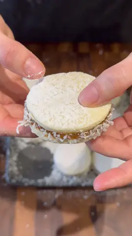 BOLIVIAN ALFAJORES RECIPE (DULCE DE LECHE SANDWICH COOKIES) INGREDIENTS: * 250 gram corn starch ( 2 cups) * 250 grams all purpose flour (2 cup) * 8 grams  baking powder ( 2 teaspoons) * 150 grams granulated sugar (3/4 cup) * 200 grams unsalted butter room tempeature * 30 grams egg yolks  * 30 grams water ( 2 tablespoons) * 4 grams vanilla extract ( 1 teaspoon) * 200 grams sweetened coconut in a bowl for topping * 100 grams Icing sugar for topping * 1 can Store bought Dulce de Leche #alfajores #bolivianalfajores #bolivia #bolivianfood #bolivianrecepies #cookies #dolcedeleche #EasyRecipe 