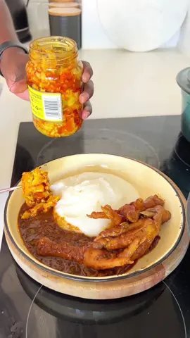 CHICKEN FEET WITH PAP AND ATCHAR #SCGS Chicken Feet recipe:   Ingredients 2 Tbsp Olive oil 1 Onion, diced ½ Green pepper, diced 1 Tomato, diced 2 Tbsp Seven Colours Grill Seasoning™ 1 Tbsp crushed Chillies 1 Tbsp Paprika 1 Tbsp Curry powder 1 Tbsp Worcestershire sauce 12 Chicken feet  500 ml Water 1 Chicken stock cube   Method Heat the oil, then sauté the onion and green pepper until soft. Add the tomato, Seven Colours Grill Seasoning™, chillies, paprika, curry powder and Worcestershire sauce. Add the chicken feet. Add the water and stock cube. Cover the pot with a lid and leave it to simmer until the chicken feet are tender and the sauce has thickened.   TIP: Serve with pap, dumplings or samp, and atchar.  #SAMA28 #tiktoksouthafrica🇿🇦 #recipesoftiktok #FoodTok #sundaylunch #chickenrecipe #chickenfeet #howtocookchickenfeet @Seven Colours Grill Seasoning 