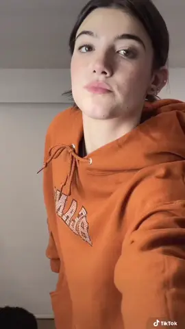 charli doing masquerade x i miss the rage in orange hoodie #charlidamelio 