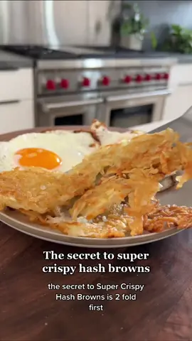 The secret to super crispy hash browns... . ▪️1 Large Russet Potato, peeled▪️1/2 Lemon, juice▪️1/4 tsp Kosher Salt▪️1 Tbsp Cornstarch▪️2 Tbsp Avocado Oil, plus a little extra▪️1 Tbsp Butter▪️ . 🌱Vegan Modification: Sub in oil instead of butter . 1️⃣ Grate the potato and squeeze on the lemon juice; mix (this will prevent the potato from turning brown) 2️⃣ Transfer the potato into a thin tea towel; twist to seal and squeeze out as much moisture as possible 3️⃣ Transfer the potato back into the bowl and mix with the salt and cornstarch 4️⃣ Preheat a large pan over medium heat and then add the butter and avocado oil; spread potato into one layer and then turn the heat to medium-low 5️⃣ Cook for 3-4 mins on one side (until golden brown), flip and drizzle a little more oil in the pan around the potato edges for extra crispiness, and cook for 3-4 mins on the other side until golden brown 6️⃣ Sprinkle with some additional salt if you please and enjoy!  . ⏲20 minute total prep + cook time . Recipe serves 3-4 people . #healthyrecipes #cookingtiktok #cookingtips #crispyhashbrowns #CookingHacks #homemadehashbrowns 