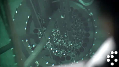 Inside a nuclear fission reactor. Uranium 235 nuclei are split into krypton and barium nuclei when bombarded with fast neutrons. Massive amounts of energy are released in the process. The blue light is due to a phenomenon called cherynkov radiation. #physics #igcse #nuclear credits to universal IQ youtube