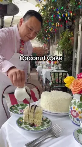 Slicing our famoua Coconut Cake #theivy #coconutcake #cake #desserttiktok #lafoodie 