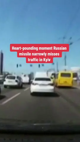 This heart-pounding moment shows a #Russian missile narrowly missing traffic in #Kyiv. Full details in our bio. 
