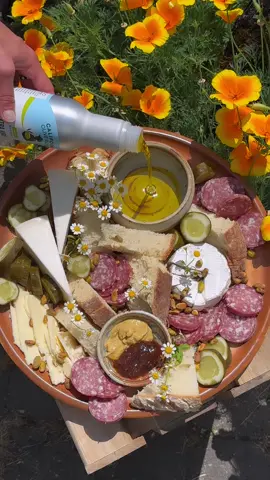 Summer inspired charcuterie featuring our new aluminum bottles 100% CA EVOO. #evoo #charcuterie #bread