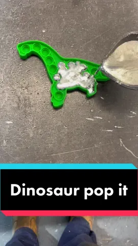Pouring metal into a dinosaur pop it #dinosaur #moltenmetal #popit #rawr 