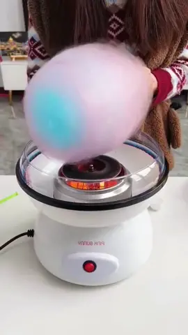 Cotton Candy Maker is a great gift for entertaining both kids and adults.Just turn on the machine, add the sugar and use the cones to catch the featherlight strands.#holidaygiftguide #cottoncandy #For the Children