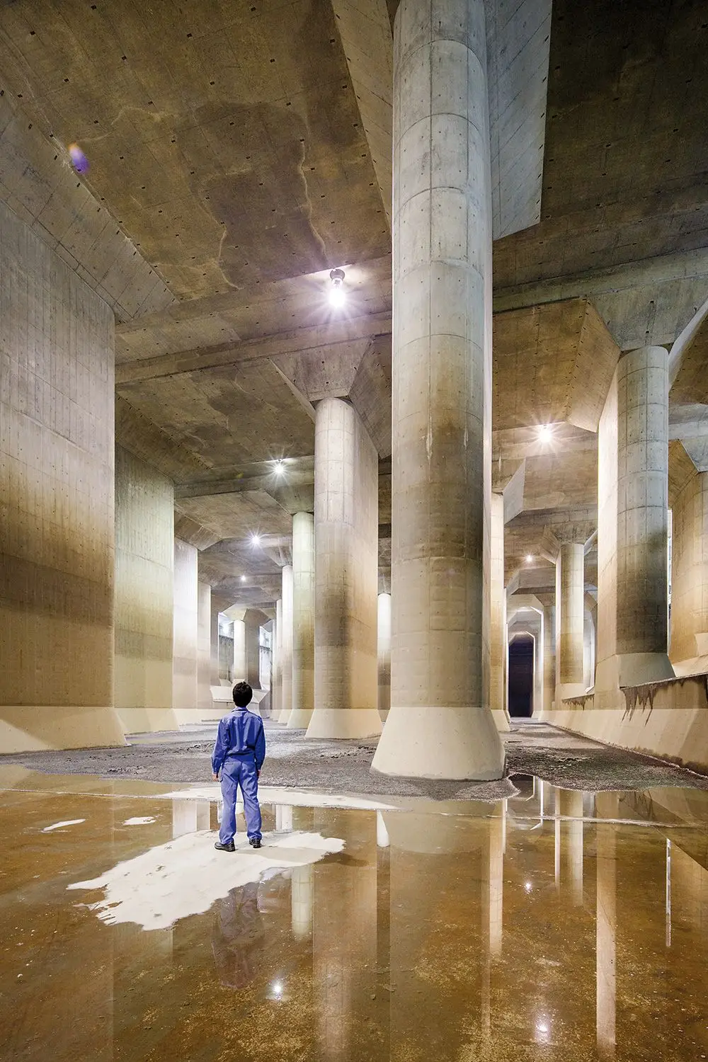 Japans $3.2 billion dollar project to eliminate flooding There is something cathedral-like about Japan’s huge underground storm drain. The G-Cans – or, to use its official title, the Metropolitan Area Outer Underground Discharge Channel – comprises a labyrinth of tunnels that stretch on for four miles in total, connecting gargantuan 213ft silos with a tank that is almost 250,000 cubic feet in volume. The sacred feeling of the space was not lost on its designers, who nicknamed this tank the Underground Temple. The G-Cans was constructed in Kasukabe, a city some 20 miles north of Tokyo. Nestled 165ft below ground between the two cities, a visitor would have no way of knowing the mammoth storm drain was there. But this invisible system serves a critical function: the densely urbanised area is low-lying and has several rivers running through it, making it highly prone to flooding. The G-Cans was built with the capacity to drain 7,000 cubic feet of water per second – the equivalent of drying out an Olympic-sized swimming pool in just over 12 seconds. The water is then pumped into the Edogawa River on the outskirts of the city. This invisible system serves a critical function: the densely urbanised area is low-lying and has several rivers running through it, making it highly prone to flooding Every summer, Japan is battered by heavy rains and typhoons. These storms can cause extensive damage and loss of life. Among the most impactful in recent history was the 1959 Isewan Typhoon, which resulted in more than 5,000 deaths. For decades, Kasukabe consisted mainly of farmers’ fields, which meant that any damage incurred by a flood was relatively minor on the national scale. But towards the end of the 20th century, Kasukabe became more urbanised and heavily populated as Tokyo expanded. It was in 1991, when a storm damaged 30,000 homes in the northern outskirts of the Japanese capital, that authorities were persuaded to invest in more protection.