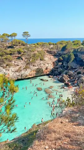 This is my favourite beach on the Island of Mallorca! Caló des Moro is a totally beautiful cove. The beach is gorgeous, especially for the crystal-clear turquoise waters, white sand, and dramatic cliffs (which you have to ramble across to get here. Yeah, you will get sweaty but it’s worth it). Best of all, the beach is located only about 5 kilometers from the town of Santanyí, which we loved and can be reached in your car or by a short hike from the nearby Cala Llombards beach. In fact, do both at once. It’s such a great thing to do in Mallorca when you visit on holiday. 
