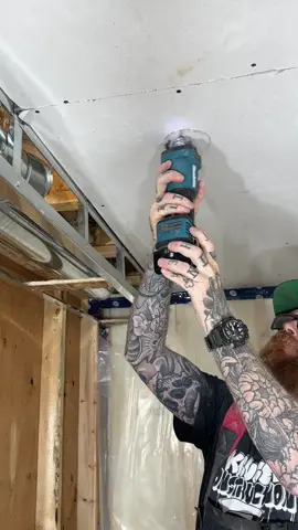 Cutting out holes for pot light with the makita cutout tool #drywall #construction #makitatools 