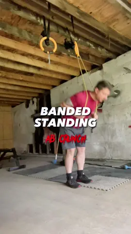 Banded Standing Ab Crunch 💪🏼 This is a great way to add resistance to your core work. Pulling and engaging on the way down and controlling the recoil on the way up. #workout #Fitness #abs #core #garagegym #dadbod 