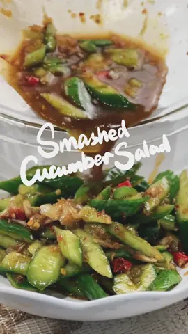 🥒 🥗 I promise you this is the best cucumber salad recipe!!! It’s more of a cold dish or appetizer type dish in China, and it’s called 拍黄瓜(Pāi Huángguā), which literally translates to Smashed Cucumber. It’s so simple and convenient, but everything blends so well together, making it one of my favorite summer dishes. 🌼 Ingredients: Cucumber (preferably mini cucumbers) 5-8 cloves of garlic Optional Thai chili  For seasonings, you also need: light soy sauce, Chine black vinegar (or other kinds of vinegar), sesame oil, chili oil, salt, and sugar. 🌼 Instructions: 1. Smash the cucumber with the knife. Don’t smash it to be all broken, slightly cracked so the juice can better wrap around the cucumber. Cut them into smaller pieces. Add in some salt to “slightly pickle” them for 5 mins. Drain the water out when it’s done. 2. Meanwhile, chop some Thai chili, and mash some garlic.  3. Combine everything in a big bowl and season it with: 1 tbsp vinegar, 1 tsp soy sauce, 1 tsp sugar, 2 tbsp chili oil (I used chili crunchy onion from @traderjoes ) and a dash of sesame oil.  4. Mix it well and enjoy 😉  Fun fact: my grandma used to make this when I spent summer vacation at her house almost every day! That is probably why I love this dish so much - it tastes like home.   hope you enjoy this recipe as much as I do! Thank you for your support here and I can’t wait to see how you make this recipe. Stay tuned and stay connected with me! #chinesefood #chineserecipe #easychinesecooking #easychineserecipe #easymeal #chinesehomecooking  #chinesesalad #cucumbersalad #smashedcucumber 