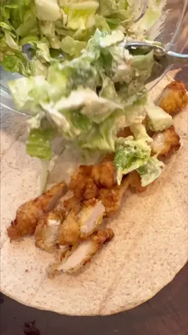 I love making crispy chicken Caesar salad wraps in the summer time. Thia short cut version is so easy, too. ##crispychicken##caesarsalad##sandwichtiktok##chickencaesarwrap