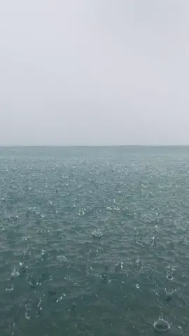 Rain pouring in the sea 🌧️🌊🤍 #rain #fyp #tiktok #happiness #amazing #beautiful 
