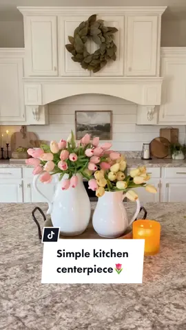 Simple kitchen centerpiece idea! 🌷 Tulips are some of my favorite flowers to use in the kitchen!❤️ #fauxflowers #whitekitchen #kitchendecorideas #kitchenaesthetic #kitchenstyling #summerdecor #kitchendecor #whitekitchen #centerpiece #homestyling #centerpieces 