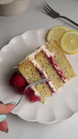 Lemon Poppyseed & Raspberry Cake ☀️ This cake is light and soft, perfect for the summer! I love adding poppyseeds into my cakes as it adds just the perfect amount of crunch which pairs so well with the soft texture of the sponge. I layered the cake with homemade raspberry jam and a creamy lemon buttercream - the flavours honestly go so well together. So fresh and delicious!  #Recipe 360g self rising flour 1 tsp baking powder 1/2 tsp bicarb 1 tsp vanilla extract 150g sugar 360ml dairy free milk  1 tsp apple cider vinegar  Zest and juice from 2 lemons  90g dairy free yogurt 90g light olive oil  6 tbsp poppyseeds  Raspberry Chia Jam  500g raspberries 1 tsp vanilla bean paste 3 tbsp maple syrup  3 tbsp chia seeds Lemon Frosting 227g dairy free butter, softened to room temperature  420g powdered sugar 1 tsp lemon extract  2 tbsp lemon juice  Method 1. Preheat the oven to 170 C Fan 2. Line 3 round cake tins (6 inch) 3. Mix together milk, lemon juice and vinegar - set aside to thicken. 4. Mix in the remaining wet ingredients. 5. Sift in the dry ingredients. 6. Pour the mixture into the tins. 7. Bake for 20-30 mins, or until cooked through. 8. Leave to cool before levelling off the cake. 9.Put the raspberries in a saucepan with the vanilla and syrup, then cook over a low heat for 5 mins. Mix in the chia seeds and cook for 10 mins. Set aside to cool completely and thicken.  10. With a hand mixer or paddle attachment on your stand mixer, cream the butter on medium-high until it’s creamy and light in colour. With the mixer on low, add the powdered sugar bit by bit, scraping down the sides of the bowl after each addition.  Add the lemon juice and extract.  12. Layer the cakes with the jam and frosting. #layercake #raspberry #vegancakes #plantbased #lemoncake #lemonpoppyseed 