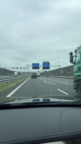 Highway Journey: Driving from the Netherlands to Brussels, Belgium In this video, the camera captures the journey of traveling on the highway from the Netherlands towards Brussels, Belgium. The highway stretches ahead, surrounded by scenic landscapes and greenery. Cars and trucks pass by in both directions, creating a constant flow of traffic. The driver's perspective provides a glimpse of the road ahead, with occasional signs indicating the distance to various destinations. The video showcases the seamless transition from the Netherlands to Belgium, as the surroundings gradually change, and road signs reflect the new country. As the journey progresses, the anticipation of reaching Brussels builds, offering a glimpse of the excitement and adventure that awaits.