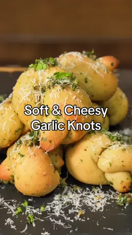 Soft & Chewy Garlic Knots (Who has the Best Garlic Knots???) • Ingredients -  425 F 13-15 Min 3/4 Cup Warm Water 2 1/2 Tsp Instant yeast 1 1/2 Tsp Olive oil 1 Tsp Sugar 2 3/4 Cup Bread flour 1 1/3 Tsp Salt 1 Tbsp Dano Cheesoning  ——————————————— Garlic Butter Sauce  4 Tbsp Butter 1 Tbsp Dano Cheesoning  3 Tbsp Olive Oil 4 Cloves Garlic (Chopped) 1/3 Cup Parsley  ——————————- #garlicbread #garlicknots #Foodie #danospartner #itscheesoning @Dan-O’s Seasoning #fyp 