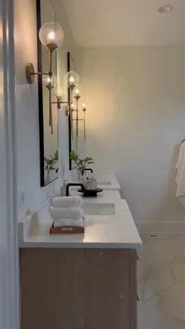 Little bathroom tour 🫶🏼 Fun fact- our bathroom isn’t fully finished! If you didn’t notice, we don’t have our tub filler installed yet. It will go in our 1/2 wall above the bathtub. We also are having glass doors and glass installed above the 1/2 wall. In a hurry to move in we decided to finish some things post construction since the shower is still 100% useable 😊  #56478sminspired #farmhouse #modernfarmhouse #blackfarmhouse #bathroomdesign #tile #lighting #design #interiordesign #vanity #customhome #ourbuildjourney #middletn 