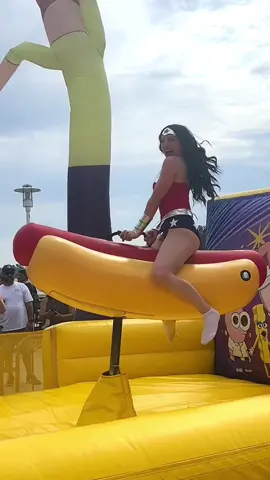 Riding a mechanical hot dog in Wonder Woman cosplay? Typical weekend activities 😂🌭