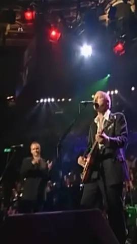 In September 1997 Mark Knopfler took part in George Martin's 'Music For Montserrat' benefit concert at London's Royal Albert Hall, where he was joined by the likes of Eric Clapton, Phil Collins and Sting for a special performance of 'Money For Nothing'. #direstraits #markknopfler #ericclapton #sting 
