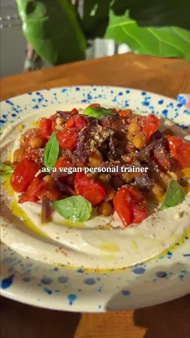 Recipes with over 50g plant protein 🌱💪  Ep. 1: Slow roasted chickpeas, onion, tomatoes with whipped tofini, quinoa and a nutty, noochy crumble.  A friend asked me to write him a meal plan for recipes containing over 50g of protein and I’ve decided to turn it into a series. Please note, I do not count fat or carb macros, as I personally find this unhelpful as the nuance of dietary fibre and monounsaturated fats are not always acknowledged. Additionally, I feel it encourages excessively strict eating habits! I am also not a registered nutritionist, however I have undergone some nutritonal training as a personal trainer. What works for me may not work for you, so please feel free to take inspiration, but always seek nutrition advice from a medical professional before making any big dietary changes 🙏 Ingredients and method on my insta page - linked in my profile or if you cant see that type ‘@sophsplantkitchen’  #veganfyp #highproteinmeals #plantprotein #veganpersonaltrainer 