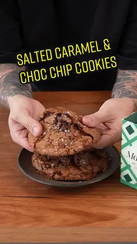 Maldon Sea Salt Chocolate Caramel Cookies - you have to try these. I've included the recipe below so you can create them at home with @Maldon Salt to accentuate the chocolate flavour #cookies #maldonsalt #chocolate #caramel #fyp  Caramel - 200g granulated sugar - a pinch of Maldon Sea Salt Flakes Cookies - 210g unsalted butter, cubed - 200g dark brown sugar - 100g granulated sugar - 2 eggs - 1 tsp vanilla extract - 330g all-purpose flour - ¾ tsp baking powder - ¾ tsp baking soda - 1 tsp Maldon Sea Salt Flakes - 300g dark chocolate, chopped - Maldon Sea Salt Flakes for finishing Method 1. To make the caramel, add the granulated sugar to a small saucepan. Over a medium heat, melt the sugar until you reach a golden amber colour, swirl the pot to mix the caramel 2. Season the caramel with a pinch of Maldon Sea Salt Flakes, then pour it onto a heat proof surface covered in greaseproof paper and set aside to harden 3. Add the cold butter, with a pinch of salt to a saucepan and melt. Once the butter has melted, continue to cook until it starts to develop a darker colour and smells almost nutty. Then, pour the butter into the bowl of a stand mixer and let it cool for 15-20 minutes 4. While the hot butter is cooling, get all your dry ingredients ready in a separate bowl, chop your chocolate into large chunks, and smash the caramel into small coin size pieces 5. Once your butter has cooled slightly, add both the sugars to it. Mix using the paddle attachment.  Once the sugar has dissolved into the butter, add the eggs one at a time and beat until the eggs have emulsified 6. Add your dry ingredients to this in 2 or 3 batches, at this point you're trying to bring the batter together - you don't want to overwork it 7. Add the chopped chocolate and caramel and mix for another 2-3 minutes 8. Line a baking tray with greaseproof paper and give it a light spray with cooking oil. Roll the cookie dough into balls and place them on the tray evenly spaced apart. Pat them down so they form a slight disc shape, then finish them with some Maldon Sea Salt Flakes 9. Bake the cookies at 180°C for 10-12 minutes. Take them out of the oven while they’re still a little bit soft. Enjoy!