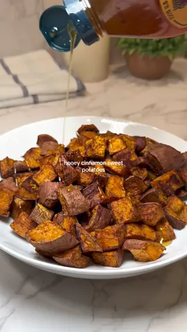 honey cinnamon sweet potatoes🍯 one of my favorite sides to make, and the best way to make sweet potatoes in my opinion. The honey and cinnamon enhance the natural sweetness of the potatoes, and create the tastiest side dish! YOU WILL NEED: •sweet potatoes (cut into cubes) •salt •pepper •cinnamon •honey •light tasting oil (I used avocado oil)  TO MAKE: Preheat oven to 425 degrees Fahrenheit. Place sweet potato cubes onto a baking sheet or pan and drizzle with oil. Sprinkle generously with salt, pepper, and cinnamon. I eyeball this and add more after if needed! Roast in oven for 40-45 minutes until thoroughly cooked and crispy. Drizzle with some honey before serving and enjoy!😊 #sweetpotatoes #sweetpotatorecipe #easyhealthyrecipes #healthyrecipes #healthysidedish #EasyRecipes 