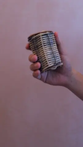 The Balinese caxixi tin shaker also known as a single caxixi shaker has been hand crafted in Indonesia from rattan and calabash discs. It gets its name from its shape being similar to a tin but the percussion instrument is stunning to look at with its contrasting colours and rustic nature. #caxixi #handpercussion #musicalinstrument 