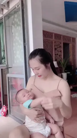 Breastfeeding Feeding a BaBreastfeeding Feeding a Baby with Pretty Mother #beautiful #breastfeeding #amazing