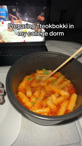 Preparing Tteokbokki in my college dorm room 🍜 🍣 #foodtiktok #FoodTok #Foodie #tteokbokki #tteokbokkirecipe #koreanfood #japanesefood #lazypotnoodle  Cooking instructions: • Bring pot of water to a simmer • Rinse tteokbokki in water • Add a glob of gochujang (depneding on desired spice level) • Add garlic • Add sugar (or brown sugar) • Add soy sauce • Bring to a boil • Pour in tteokbokki (rice cakes) • Simmer for 3 min with lid then stir • Add spam or Korean sausages (optional) • Let boil for 5 more minutes then lower heat gradually • Add cheese while still hot so it melts • Add chopped spring onion • Garnish with sesame seeds or nori Enjoy with friends or a kimbap!😀