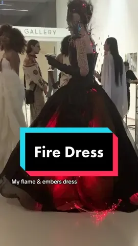 Dress I designed and created inspired by flame a s embers with lighting #fashiondesign #lightupdress #techfashion #gothicdress #girlonfire 