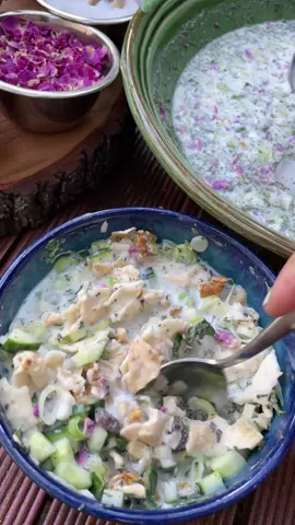 💚🤍❤️ persian cold soup perfect for summerdays   Ab Doogh Khiar - is a Persian cold soup that has not lost its popularity since the ancient Persian Empire until today, despite its simplicity.  Ab = water Doogh = yogurt drink similar to Turkish Ayran Khiar = cucumber The soup is sooooo refreshing on hot days friends. In the heat, Ab Doogh Khiar is simply the best thing ever!  Like many Persian dishes, you just have a flavor explosion with such a simple recipe and it is so complex in flavor. It can be spooned as is or dried lavash bread soaked in it. Recipe for 4 people: 600 g yogurt (3,5 % fat) 1 large cucumber 2-3 spring onions, a handful of fresh mint leaves 1 tbsp dried mint 2 tbsp currants 300 - 400 ml (mineral) water 1 tsp. salt 3 tbsp walnuts optional: dried persian rose petals Dry thin bread - you can put the bread in the microwave for 30 seconds and let it dry out in the air for a short time.   #persianfood #foodtiktok #iranianfood #abdooghkhiar #Love #fypシ 