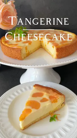 Tangerine Cheesecake Recipe 👩🏻‍🍳🍊 Indulge in the delightful taste of Tangerine Cheesecake. 🥧 Ingredients for the Shortcrust Pastry: - 200 g all-purpose flour (Type 405) - 75 g sugar - 1 egg - 75 g cold butter - 1 tsp baking powder 🍊 Ingredients for the Filling: - 500 g quark or cream cheese (low-fat, well-drained) - 2 eggs - 140 g sugar - 37 g cornstarch - 100 g sour cream (10% fat content) - 70 ml  cream (32% fat content) - 70ml sunflower oil - 175 g Tangerine (canned, well-drained and dried) 🍊 Ingredients for the Clear Glaze: - 200 ml liquid (mandarin juice from the can, topped up with water to reach 200 ml if needed) - 2 tbsp cornstarch - 1 tbsp sugar 👩🏻‍🍳 Preparation: 1. Preheat your oven to 170°C (338°F) in convection mode. Grease a springform pan (26 cm in diameter) well. 2. For the shortcrust pastry: Mix the flour, sugar, and baking powder. Knead in the egg and cold butter until a dough forms. Wrap the dough in plastic wrap and refrigerate for about an hour until firm. 3. After an hour, remove the shortcrust pastry from the refrigerator. Roll out two-thirds of it for the base and shape one-third into a rim about 3.5 cm high. 4. For the filling: By hand, combine quark or cream cheese, eggs, and sugar in a mixing bowl. Mix cornstarch, oil, sour cream, and heavy cream together, add this mixture to the quark mixture, and gently fold it in. 5. Pour the quark filling onto the prepared crust, distributing the Tangerines evenly on top. 6. Bake the cake at 170°C (338°F) for about 50 minutes in convection mode, until the filling is firm and the sides are lightly golden. 7. After baking, allow the cake to cool completely. 8. For the clear glaze: Mix the liquid, cornstarch, and sugar in a small saucepan. Stir over medium heat until the glaze thickens and becomes clear. Let the glaze cool slightly. 9. Gently pour the cooled clear glaze over the surface of the cake. 10. Let the cake cool completely before removing it from the pan and serving. Optional: You can also use a store-bought clear glaze. The glaze can be omitted if desired. Enjoy this refreshing Tangerine Cheesecake👩🏻‍🍳  #cheescake #cake #dessert #cakerecipe 