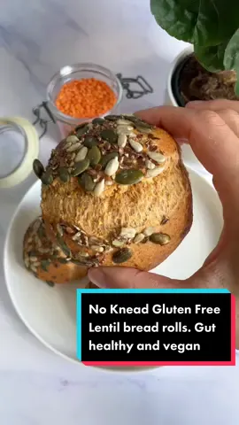 NO KNEAD GLUTEN FREE LENTIL BREAD ROLLS These easy vegan, coeliac friendly/gluten free lentil bread rolls are good for your gut and waistline (low calorie). And no grains, flour, sugar or yeast is used Nutritional value per roll (w/o toppings): 14.5/13.4 g dietary fiber, 14.8/12.8 g protein, 200 g legumes Prep: < 10 min Soaking time: > 2 h Oven time: 25 min Yields: 4 rolls   Ingredients: •200 g (1 cup) dry red lentils, rinsed •20 g (¼ cup) whole psyllium husk (not powder) •60 ml (¼ cup) water •1½ tbsp olive oil •½ tsp baking soda •½ tsp salt •½ tbsp lemon juice or apple cider vinegar   Toppings (optional but highly recommended): 3 tbsp mixed seeds e.g. pepitas (pumpkin seeds) + sunflower seeds + crushed linseeds   Method: -Soak the red lentils in plenty of warm water for at least 2 h or overnight, then drain it -Preheat the oven to 350°F/180°C. Line a baking tray with parchment paper or a silicon mat -Add lentils together with all the ingredients (except the toppings) to a food processor but add the lemon juice/vinegar last (preferably on top of the soda) because the reaction between the acid and the baking soda is immediate (bubbles) and we do not want it to lose that momentum. Immediately start processing until a dough forms. Don’t let the dough rest, quickly shape the bread rolls by hand (wet your hands a bit), roll the top in the seed-mixture and place it on the baking tray. Bake for 25 min until golden brown and crispy. Remove from oven and transfer to a cooling rack to cool for at least 15 min before slicing it   Tip: the bread rolls are best eaten fresh, but can be stored in an airtight container at room temp up to 2 days and in the freezer up to 2 months   #glutenfreebreadrolls #lentilbread #redlentil #lentilrecipe #psylliumhusk #breadrolls #breadrollrecipe #dinnerrolls #nokneadbread #noknead #rolls #bunrecipes #glutenfree #homemadebreadrolls #sandwichrolls #glutenfreebaking #celiacfriendly #coeliacfriendly #coeliac #celiac #veganbread #noyeastbread #lowcaloriebread #highproteinbread #guthealthyrecipes #guthealthrecipes 