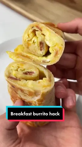 Say “YUM” if you would eat this easy breakfast burrito 🍳🌯  To make it just add butter, eggs, bacon and shredded cheese to a pan on medium heat.  Press a tortilla down on to the cheese, let it cook for a couple minutes, flip it & let the tortilla crisp up. Take it off the pan, roll it up & enjoy 😋👌