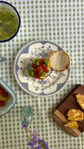 Recipe:  ~Begin by slow roasting cherry tomatoes in olive oil and a pinch of salt.  ~In a separate pan, fry halloumi until golden.  ~Create a flavorful avocado mash by combining mashed avocado with ground cumin, fresh coriander, lemon juice, and salt.  ~Spread the avocado mash on a lightly toasted English muffin, then layer with the fried halloumi.  ~Carefully place the roasted tomatoes on top and garnish with fresh basil.  #tomatoes#summercooking#summerfood #brunch 