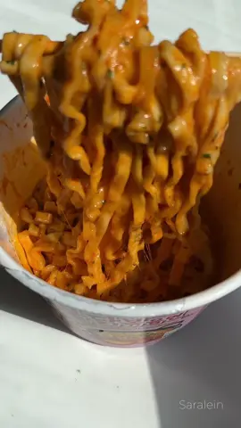 Samyang Carbonara Buldalk Instant Noodles  1. First, open the lid of the cup. 2. Inside, you'll find two sauce packets. Take them out. 3. Boil some water and fill the cup up to a marked line. 4. Close the lid and be patient for 4 minutes. 5. Use a chopstick to make small holes in the lid to let any extra liquid drain out. 6. Now, gently stir the noodles to prevent them from clumping together. 7. Add the spicy sauce packet and mix it in. 8. Next, add the cheese powder and give it a good mix as well. 9. Here's a tasty twist: pour in 3-4 tablespoons of heavy cream and some shredded mozzarella. Pop it in the microwave for 2-3 minutes until the cheese melts. 10. Enjoy  . . . . . . . . . . . . . . . . . . . #buldak #noodles #buldakcarbonara #instantnoodles #instantramen #cheese #cheeseramen #samyang #conveniencestore #koreanconveniencestore #carbonararamen #편의점 #asmr 