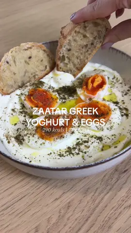 ZAATAR GREEK YOGHURT & EGGS 🥚  A perfect high protein, savoury breakfast to try! Make sure to press that save button for later ☝🏼 •290 kcals (without bread) •20g PRO, 5g CHO, 19g FAT Serves 1: -2 soft boiled eggs (or eggs of choice) -100g of plain Greek yoghurt -Lemon zest -Lemon juice (use the end of the lemon) -1 tsp of olive oil -Zaatar -Salt/pepper Method: 1. Boil the eggs for approx. 6-7 mins (if you want them soft boiled). Once done place in cold water for 2 mins then peel off the shell and cut them in half.  2. Add the Greek yoghurt to a bowl and spread out.  3. Add the lemon juice, lemon zest and olive oil.  4. Top with the eggs and a sprinkle of zaatar. Season with salt/pepper. 5. Serve with your bread of choice or enjoy on its own. Enjoy! #greekyoghurteggs #greekyoghurt #eggs #breakfast #breakfastideas #brunch #zaatar #EasyRecipes #healthyfood
