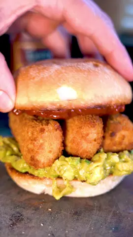 Fish Finger Sandwich Take your fish finger sandwiches to the next level with @Sauce Shop X @Only Scrans Curry Ketchup Ingredients - per sandwich: 3 jumbo fish fingers 1 bread bap 2/3 avocado  2 spring onions 1/2 lime  1 tsp soy sauce 1/2 tsp chilli flakes 1/2 sea salt flakes 1 tsp sesame seeds Method: - Cook your fish fingers in the oven using the instructions on the packet - Add you avocado, spring onions, soy sauce, lime juice, salt, chilli flakes, sesame seeds and mash it all up and put to the one side - Half your bread bap, add some olive oil and toast in a frying pan - Add your Curry Ketchup to the toasted bap  - Remove your fish fingers from the oven and it’s time to build - Add the avocado to the toasted bap, then add your fish fingers on top and then the toasted bap with ketchup - Enjoy! #fishfinger #recipes #foodrecipe #tiktokrecipe 