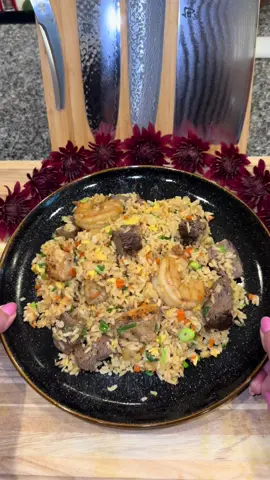 Hibachi Inspired Fried Rice♥️ #hibachi #Recipe #friedrice #tiktokfood  Start out by getting about 2 pounds of your favorite Hibachi meat combination. (You can use whatever meat you want!) I used: -about a 1/2 pound of Filet Mignon  -1 pound of chicken breast  -and a 1/2 pound of shrimp  Season it all with a little salt and pepper.  Then in a pan on medium-high heat with high heat oil, you’re going to sear your meat on both sides. (You don’t need to worry about cooking it all the way through, you just need to get a nice sear for that hibachi taste.)  Then turn off the heat and take your pan off the burner to let it cool down.  While it’s cooling, cut your meat into cubes.  Then in the same pan on medium heat,add a little extra oil then add your chicken back in.     Once it’s fully cooked, add: -3 tablespoons of butter -1 tablespoon of minced garlic  -the rest of your meat  -3 tablespoons of soy sauce Cook it until the shrimp are fully pink, then set all of the meat aside.  Then in a wok or a large pan on medium heat with oil, you’re going to add: -3 whisked eggs  Scramble and chop them up then set them aside.  Then add: -1 cup of diced onion -1/2 cup of finely chopped carrots  Cook until the onions run clear.  Then add: -1 tablespoon of minced garlic  -2 tablespoons of butter  -6 cups worth of cooked jasmine rice (which is 2 cups uncooked.)  It’s best to use day old rice. You can use fresh rice, but it will have a softer texture.  Once the rice is warmed, add in: -1/4 cup of soy sauce  -the eggs -1 cup of sliced green onion  -and all of the meat (if you want to add a little bit of the sauce from the meat, that’s fine just remember to not add too much or the rice will be too salty)  Then toss it all together and serve with Yum Yum Sauce (I’ll be posting the recipe for this right after I post this video)  Enjoy💜
