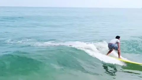 WOOOO!!! WAY TO GO!!!   Local players participate in the 2023 Hainan Surfing Championship at Riyue Bay in southern China's Hainan Province.