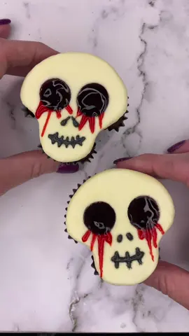 Spooky skeleton baking hack! ☠️ Don't forget the Cookie Icing mouth and creepy Blood Red Glaze eye holes 👀🩸 #HorrorCupcakes #HalloweenDesserts #WiltonCakes #BakingHacks   