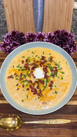 Loaded Baked Potato Soup🥔 #soup #potato #potatoes #recipes #recipesforyou  Start out by chopping up 1 pound of bacon and cook it in a pot on medium heat.  Cook it until it’s nice and crispy and set it aside on a paper towel.  Remove some of the bacon grease from the pot leaving about 3 to 4 tablespoons in there.  Then add: -1 cup of diced onion -1 tablespoon of minced garlic Cook until the onions run clear and then add: -4 tablespoons of butter  Then once the butter is melted add: -1/3 cup of flour  And whisk it all together until smooth  Then slowly whisk in the following (slowly and a little bit at a time): -2 cups of 2% milk -1 cup of heavy whipping cream  -1/2 cup of sour cream  -3 cups of chicken broth  Once it comes to a simmer add: -4 cups worth of cooked and peeled potatoes. (I’m using the insides of the potato skins I made in my last video, but you can just boil and chop up some potatoes or bake some in the oven.)  Season to taste with: -chicken bouillon powder  -paprika -and salt and pepper Then add: -1 cup of freshly shredded cheddar cheese  -the majority of your crispy bacon (make sure to save a little for garnishing.)   Then serve once the cheese melts and top it off with: -a little more cheese -your bacon  -chives or green onion  -a dollop of sour cream  Enjoy💜