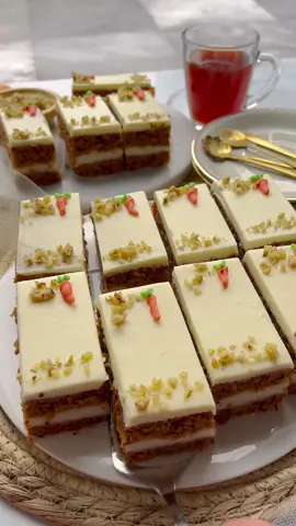 MOIST CARROT CAKE WITH CREAM FILLING #carrotcake #cake #food #Recipe #tiktokfood #fy #fyp #foryou #foryoupage   CARROT CAKE BATTER 3 eggs (medium) 80 g brown sugar 80 g granulated sugar 8 g vanilla sugar (1 packet) 170 ml sunflower oil 3 g cinnamon powder (1 teaspoon) 250 g carrots 85 g walnuts pinch of salt  180 g flour (all-purpose flour) 10 g baking powder   FILLING 500 ml milk 50 g cornstarch 85 g granulated sugar 8 g vanilla sugar (1 packet)   TOPPING 50 ml whipping cream 150 g white chocolate 250 g mascarpone   EXTRAS walnuts INSTRUCTIONS   Place the walnuts in a food processor and grind them finely. Grind the carrots in a food processor or grate them finely. Break the eggs into a bowl. Add brown sugar, sugar, and vanilla sugar. Mix until the batter becomes frothy. Add the sunflower oil, cinnamon powder, carrots, walnuts, and salt. Sift the flour and baking powder into the bowl. Mix until smooth. Put a portion of the carrot batter (375 grams) into a greased springform or baking pan, and don't forget to use parchment paper. Place the carrot cake in a preheated oven at 175°C (347°F). Bake for 8-10 minutes. Meanwhile, heat the milk in a saucepan over medium-high heat. Add the cornstarch, sugar, and vanilla sugar. Cook the milk mixture, stirring constantly, until it thickens. Carefully remove the carrot cake from the oven and evenly distribute the milk mixture over it. Add the remaining cake batter. Place the carrot cake back in the preheated oven at 175°C (347°F) and bake for 25 to 30 minutes. Monitor the baking time, as every oven is different. Let the cake cool. Melt the white chocolate using a double boiler. Allow it to cool. Put the crème fraîche in a deep bowl and add the whipping cream. Mix until smooth. Add the cooled white chocolate and mix well. Spread the topping over the cake and smooth it out. Cut the carrot cake into pieces. Garnish the carrot cake with chopped walnuts and pipe on some carrot decorations.   1 hour 30 minutes - Makes 12 pieces    