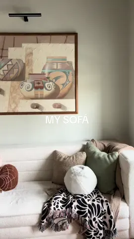 Replying to @curlee_lepoof “ALLOW ME TO REINTRODUCE MYSELF” su nombre se llama WHITE SHERPA CHANNELED SOFÁ from @Living Spaces this was el sofa de mis sueños it’s UNIQUE and only available in select stores 🤎 head to their website and type in the SKU# 295192 & it will pop up to see if it is in-stock at your nearest store!!! The first videos AR when they had just brought in the couch (FUN FACT: the guys struggled to get it in the door, and was 🤏🏽 close to taking it back but I was like pleaseee IM A STARRR make it fit removed the legs and made it inside) the second videos is how I styled it, I love my new talavera cobija from @Ficus and plants LLC Also — need to change some pillow covers to make it fit mi aesthetik que piensan de todo?? #misofa #livingspacesinteriors #midecoración #casitamexicana 
